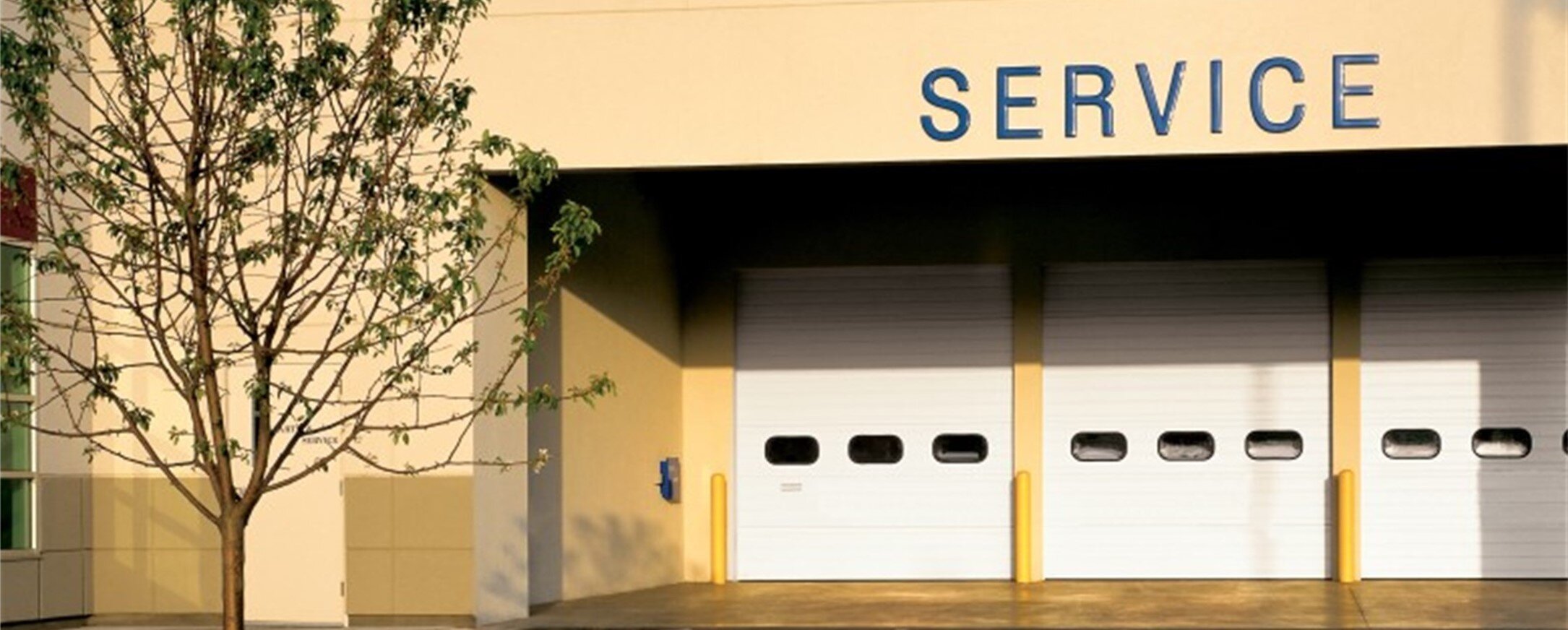 Thermacore® Model 598, Ribbed, Textured Panel, White Finish, Double Thermal Acrylic Glazing Lites Thermacore® Sectional Steel Door 598 Overhead Door of So Cal