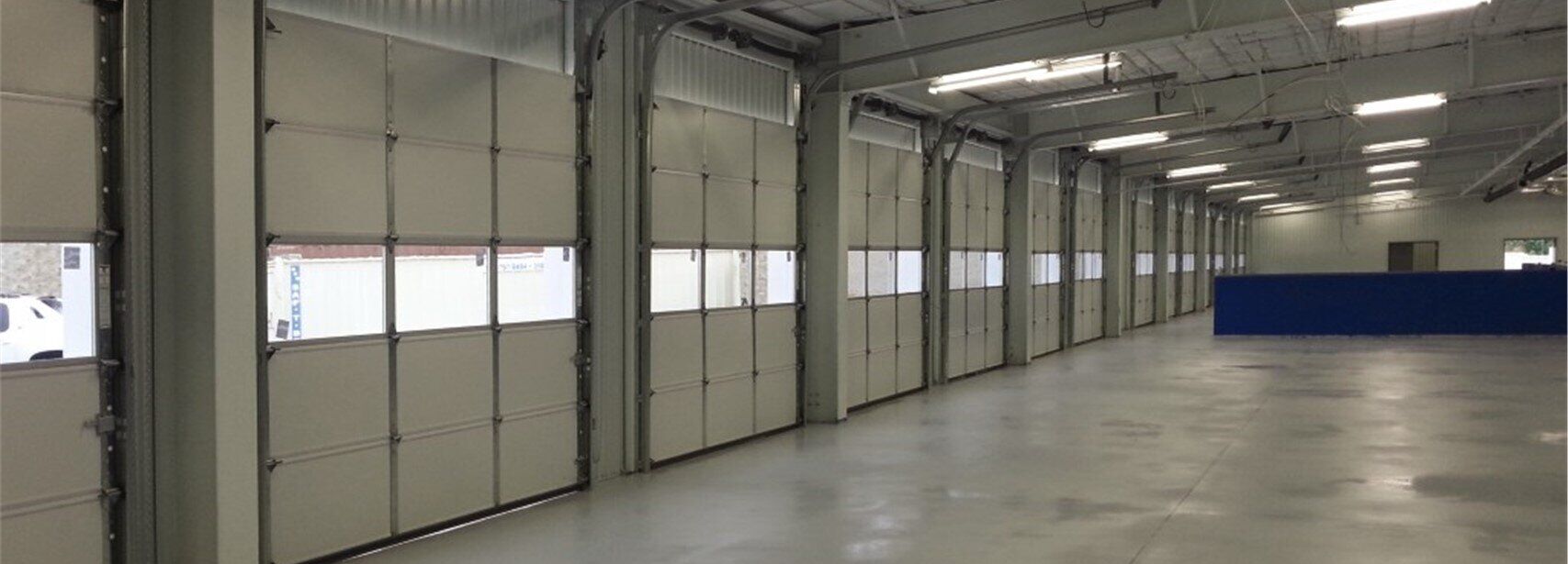 Sectional Steel Doors, Model 426 with Aluminum Sash Section with DSB Glazing, Interior View Insulated Sectional Steel Doors, Overhead Door Co. of SoCal™